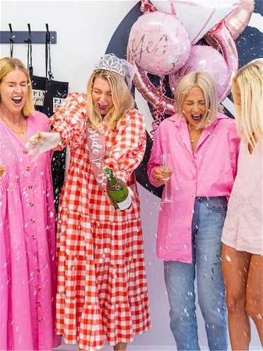 Hens Party Ideas Girls Popping Champagne at Pinot & Picasso.